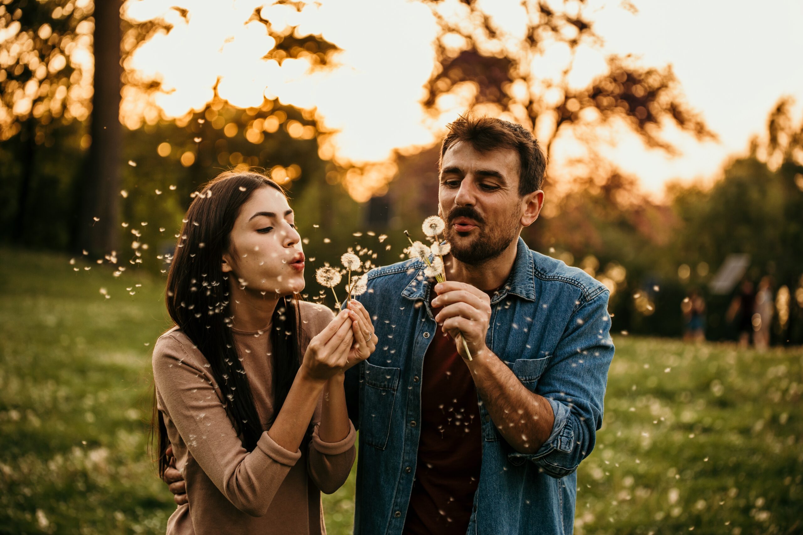 couple with allergies, in meadow breathing easy